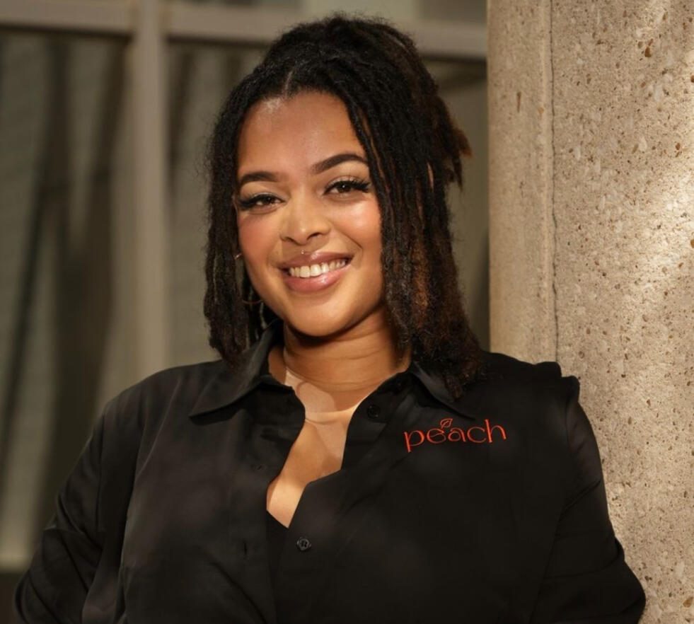 Nyla Bland Nyla Bland smiling as the founder of Peach Marketing Firm